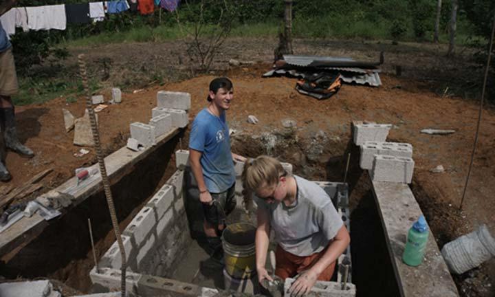 Students working on a foundation during a mission trip